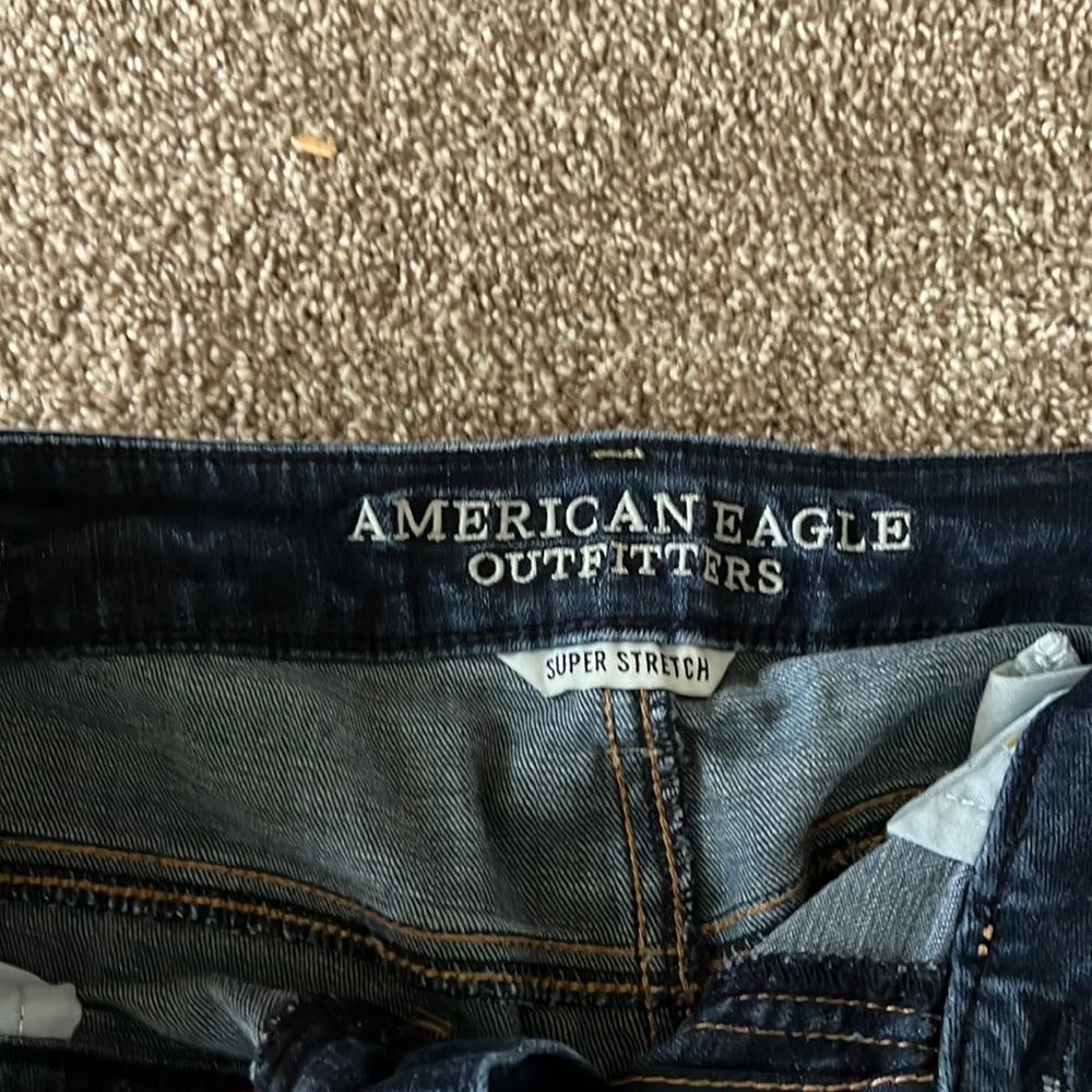Dark-wash with faded detail, zips work well, US size 8 long